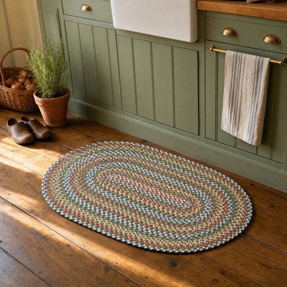 Roxbury Spruce Green braided rug, 2x3 oval accent mat at a cottage kitchen sink #Size_2' x 3' Oval