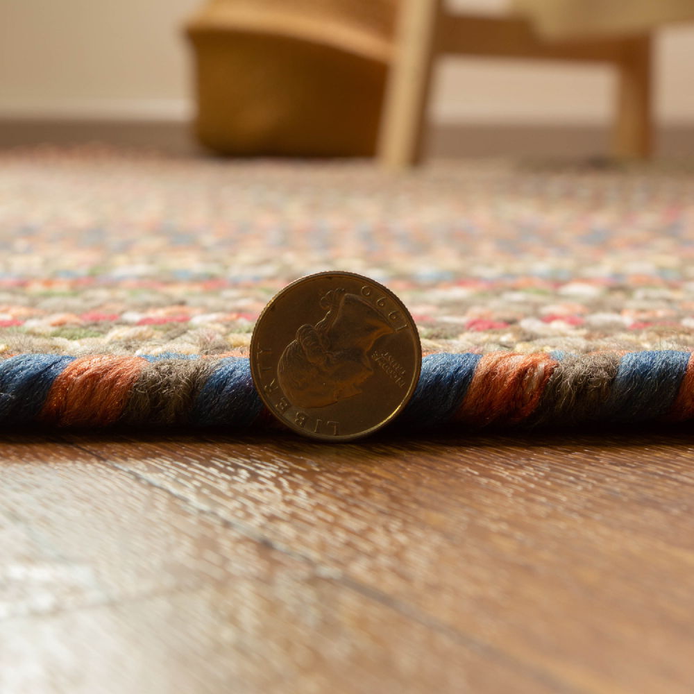 Roxbury Dark Taupe braided rug, close up of the braided edge