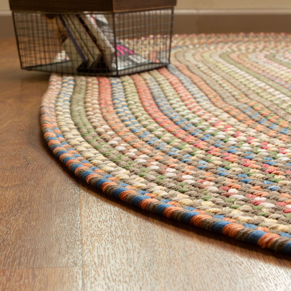 Roxbury Dark Taupe braided rug styled in a room setting
