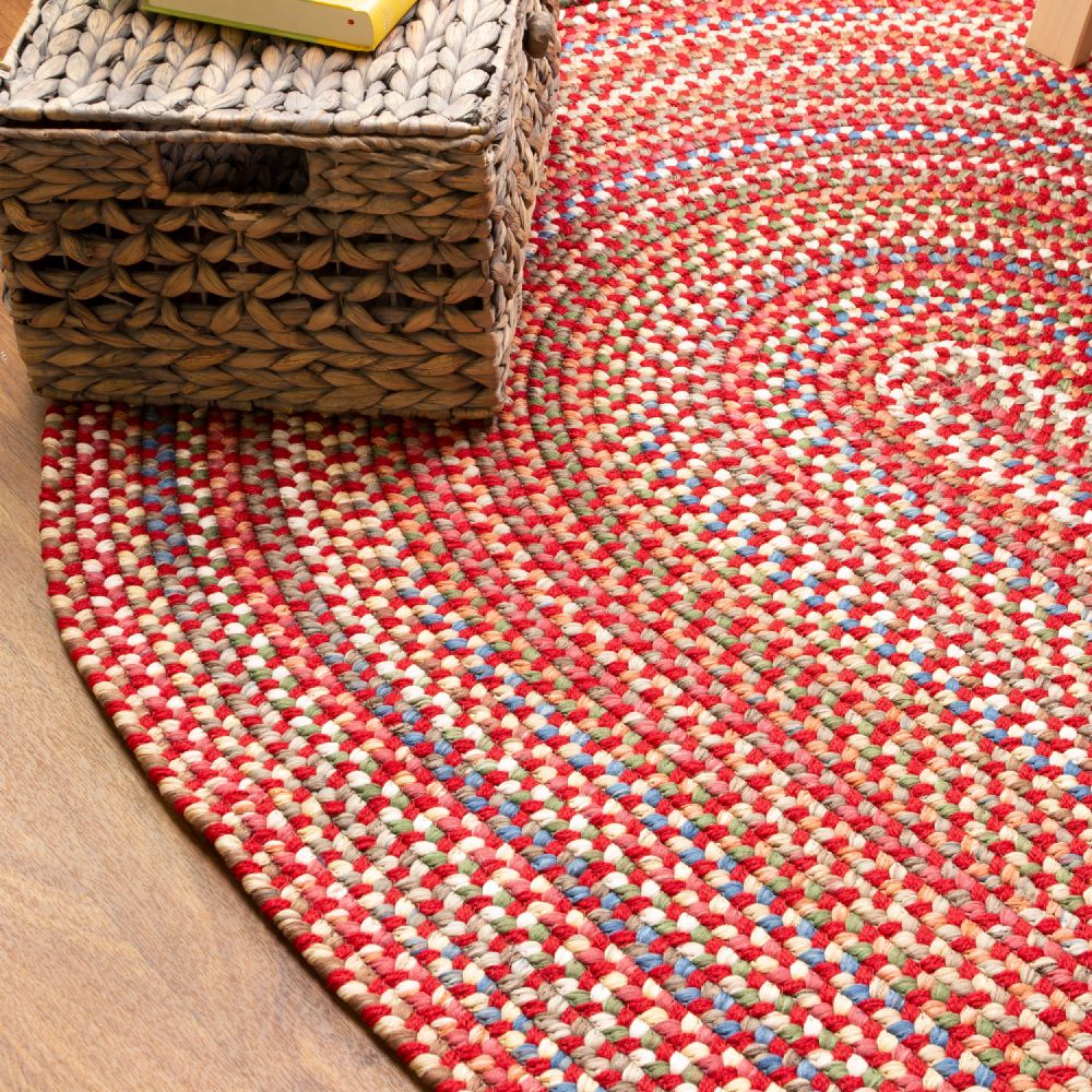 Roxbury Red braided rug styled in a room setting
