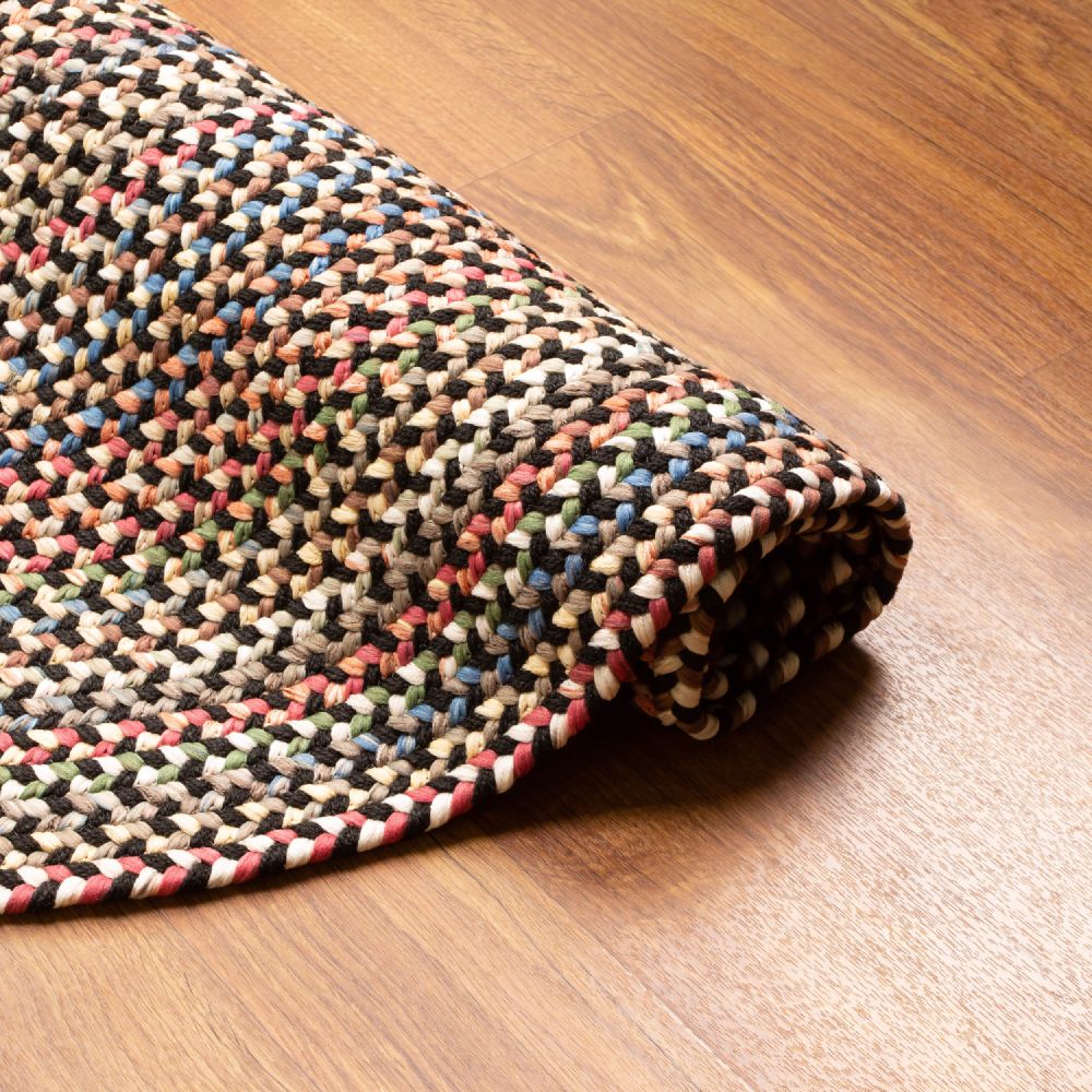 Roxbury Charcoal braided rug rolled to show the braid construction