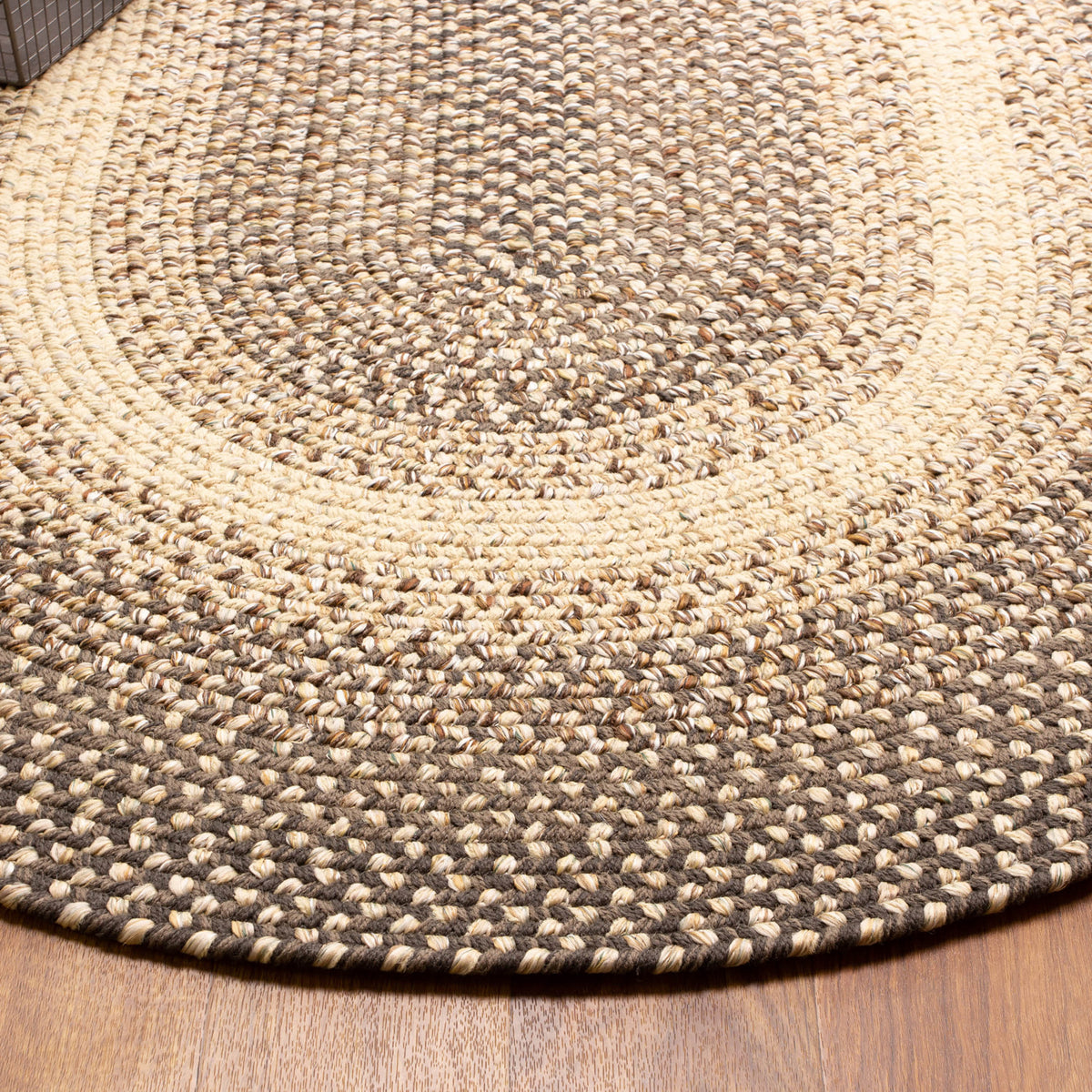 Ridgewood brown braided wool rug - close-up of the braided surface and colour bands