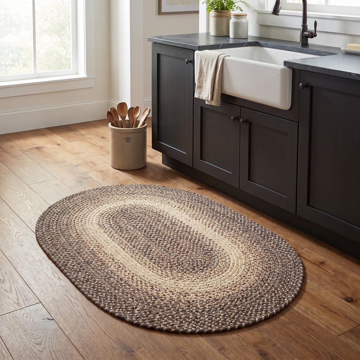 Ridgewood brown braided wool rug, 2x3 oval accent mat in front of a farmhouse kitchen sink #Size_2' x 3' Oval