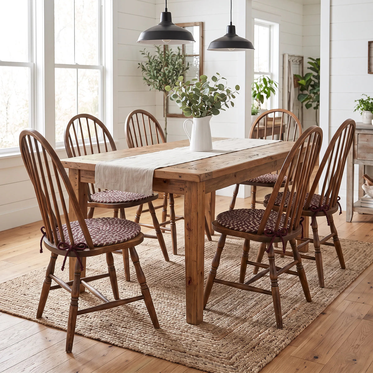 Ridgewood Braided Chair Pads - Burgundy - on six Windsor chairs at a modern farmhouse dining table