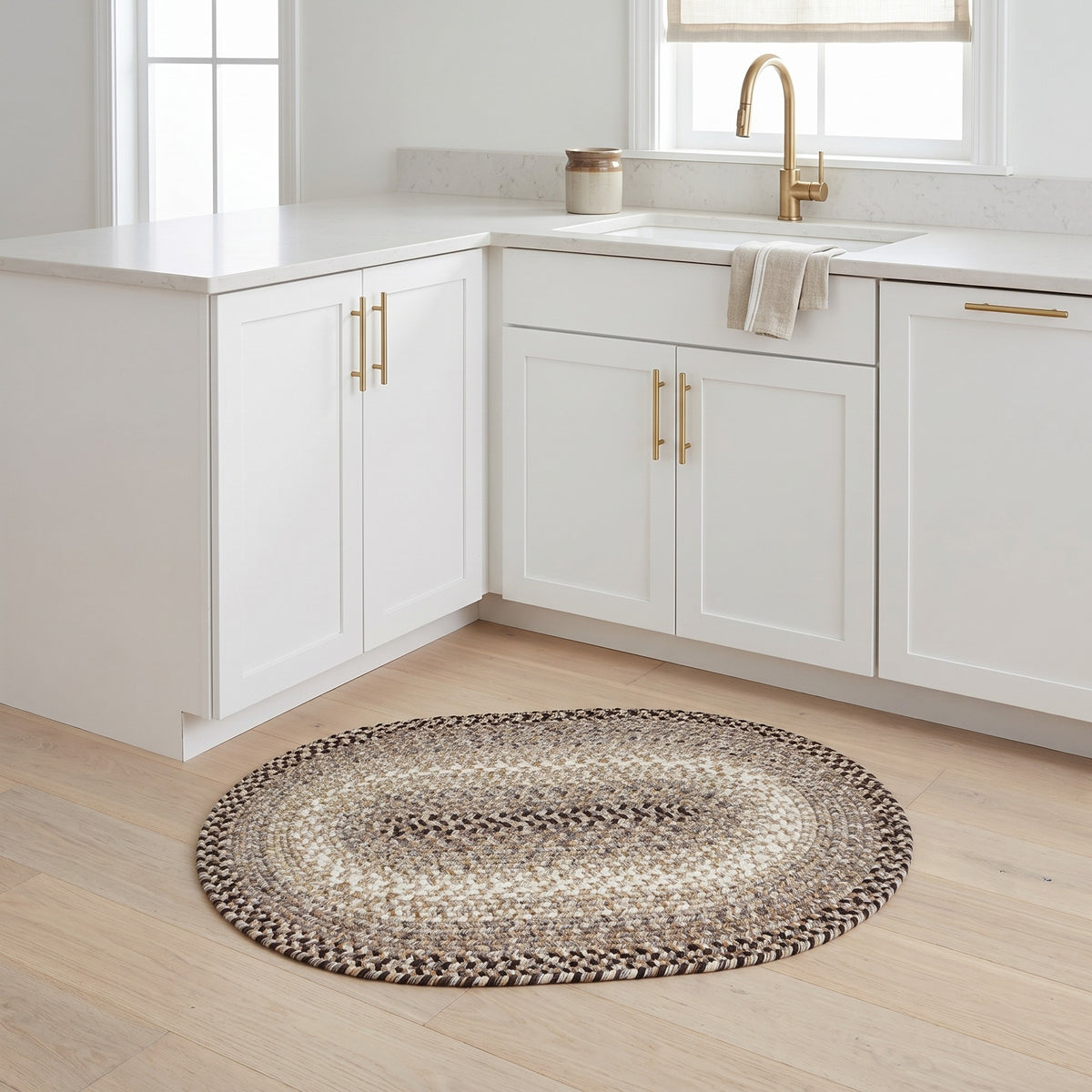 Ridgewood gray braided wool rug, 2x3 oval accent mat at a white kitchen sink #Size_2' x 3' Oval