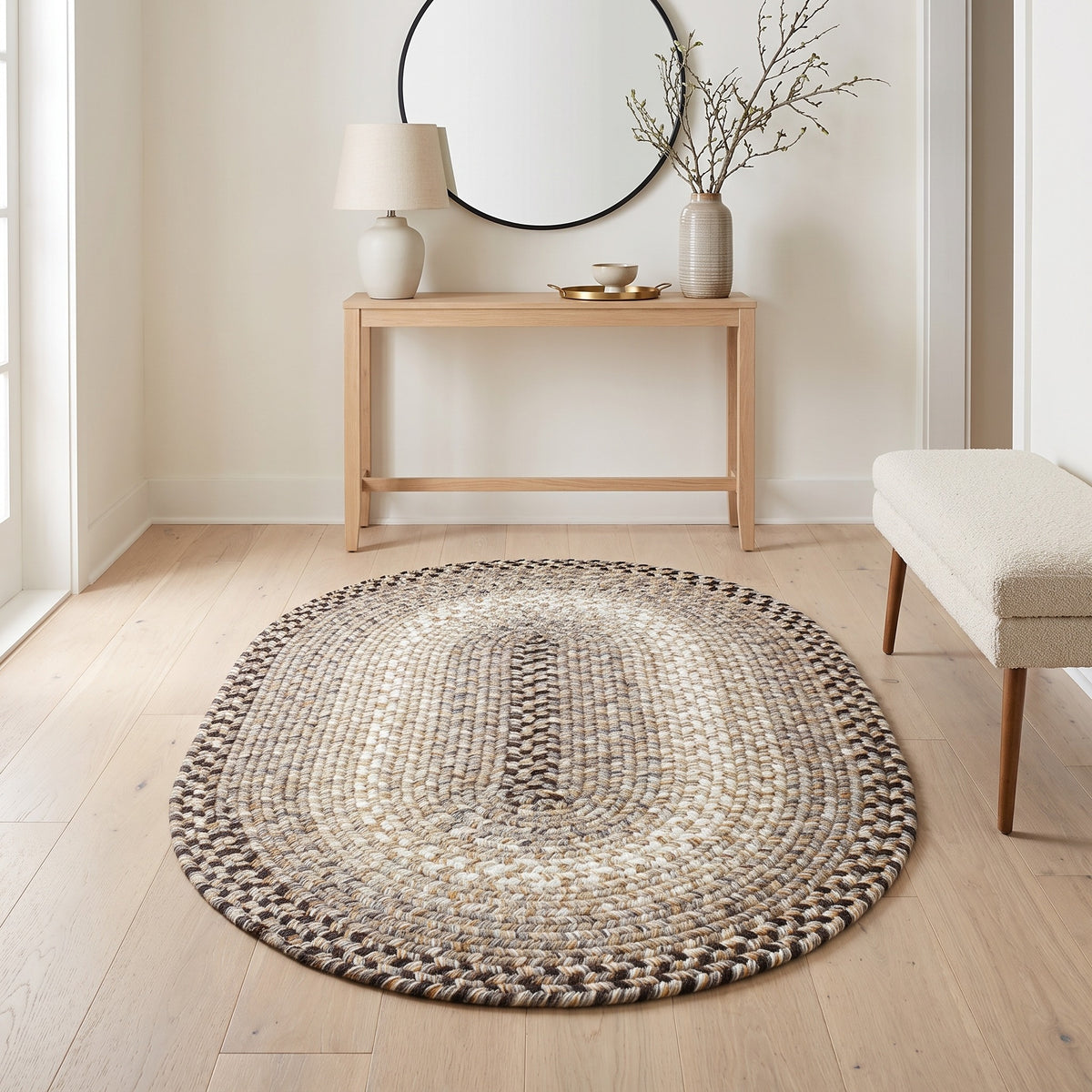 Ridgewood gray braided wool rug, 3x5 oval in an entry hall beneath a console table #Size_3' x 5' Oval