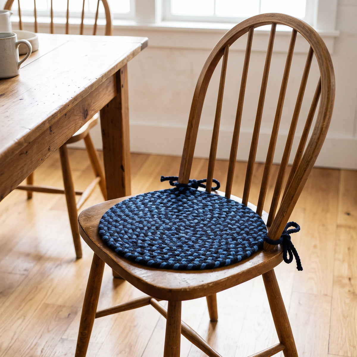 Santa Maria Braided Chair Pad - Old Glory - tied on a wooden Windsor dining chair