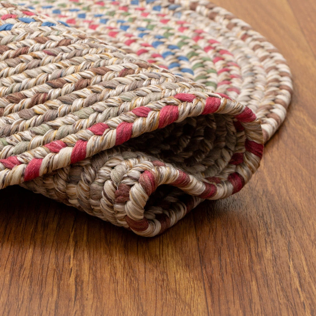 Sandy Beige Portsmouth rug folded back to show the reversible underside