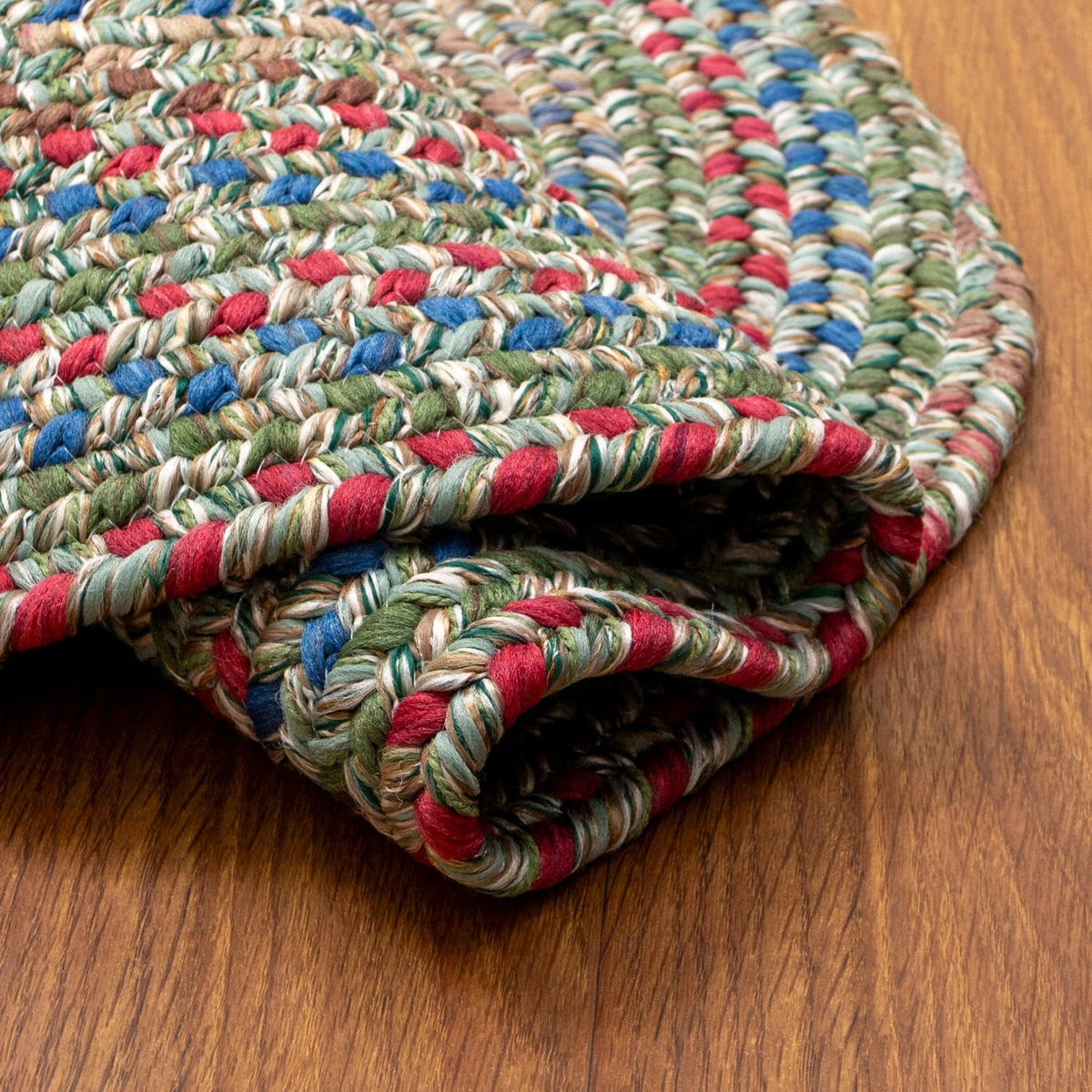 Moss Green Portsmouth rug folded back to show the reversible underside