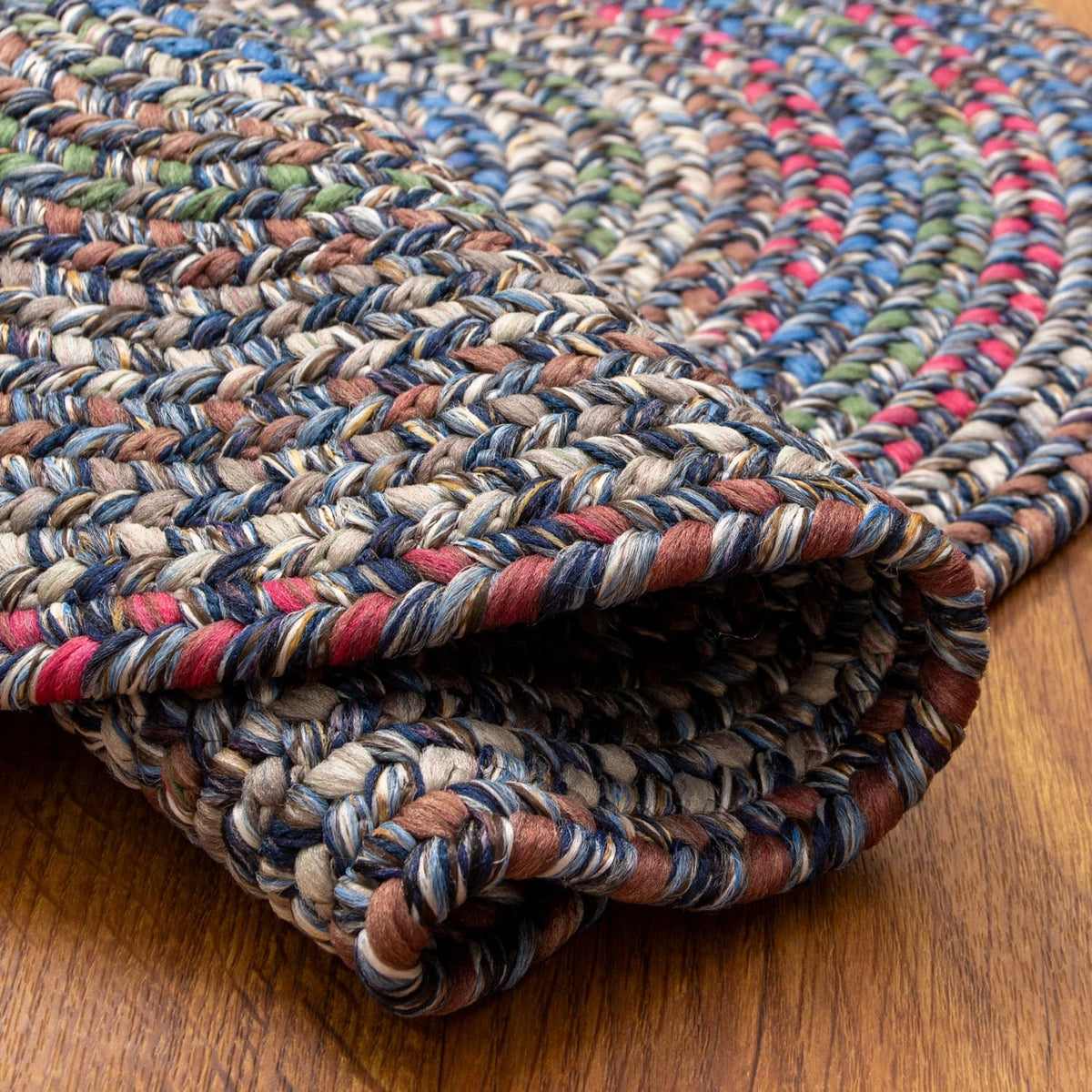 Blue Portsmouth rug folded back to show the reversible underside