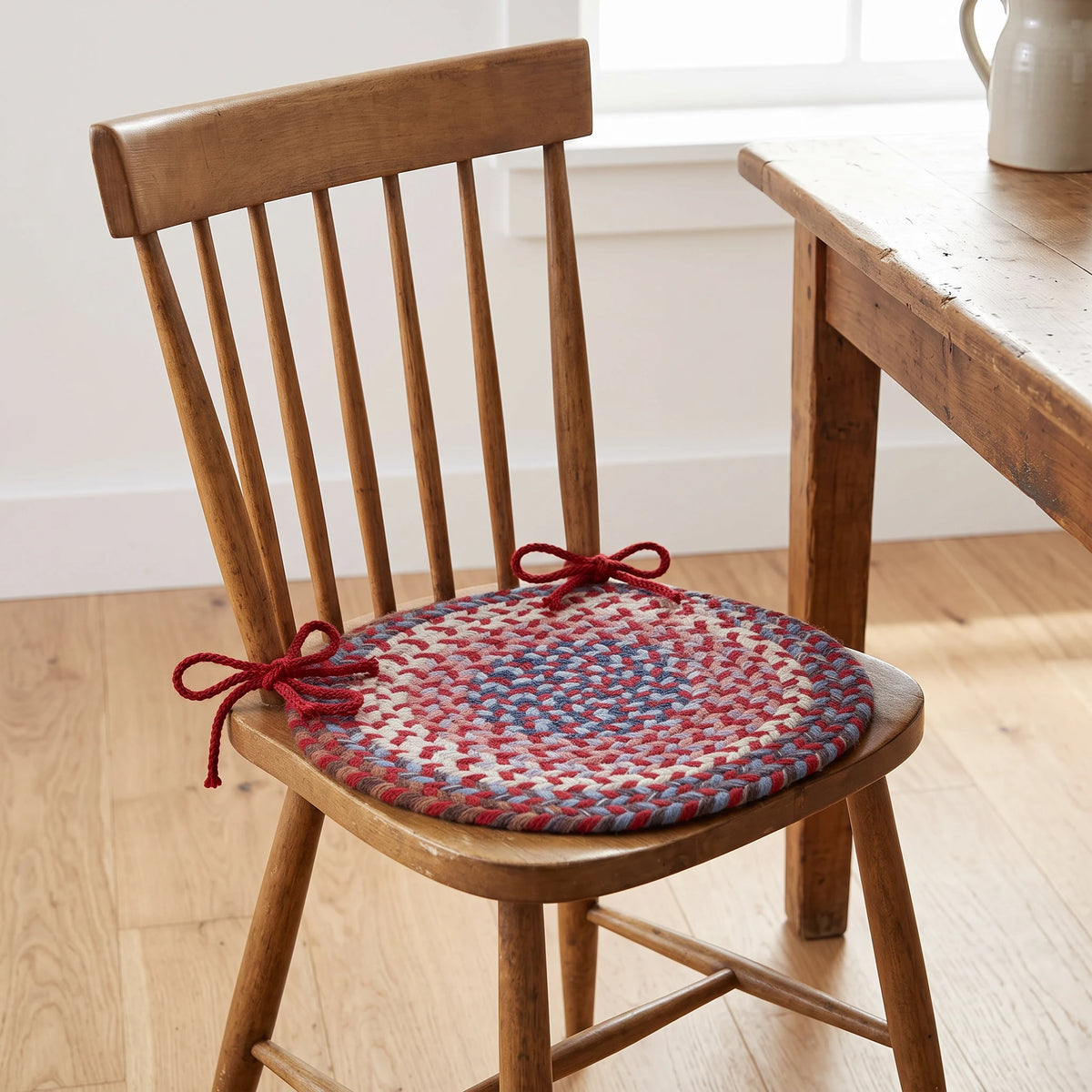 Tribeca Braided Chair Pad - Red Velvet - tied on a wooden Windsor dining chair