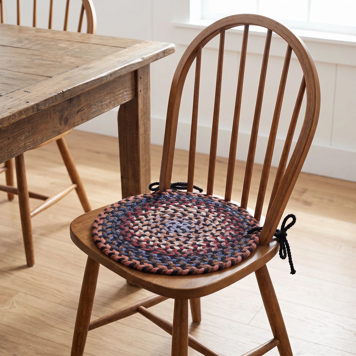 Tribeca Braided Chair Pad - Black Rock - tied on a wooden Windsor dining chair