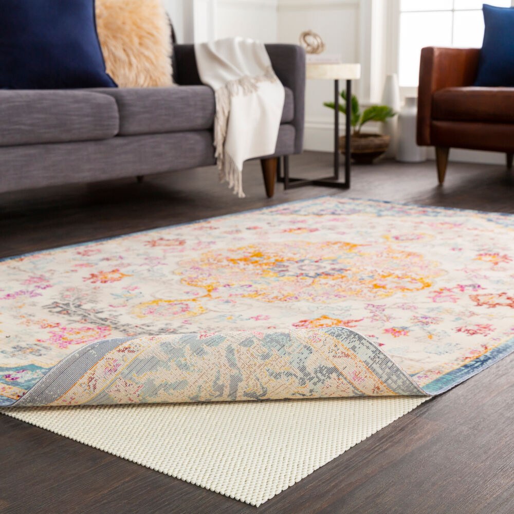 Luxury Grip rug pad under an area rug in a living room