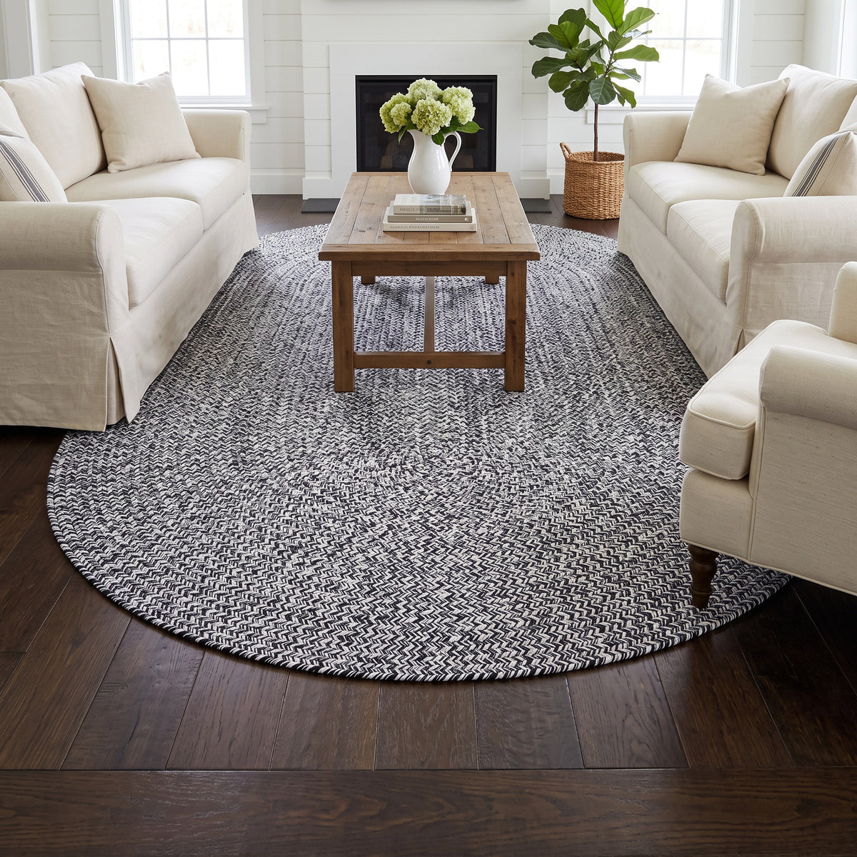 Rustica black and white braided cotton rug, 6x9 oval in a farmhouse living room #size_6' x 9' Oval