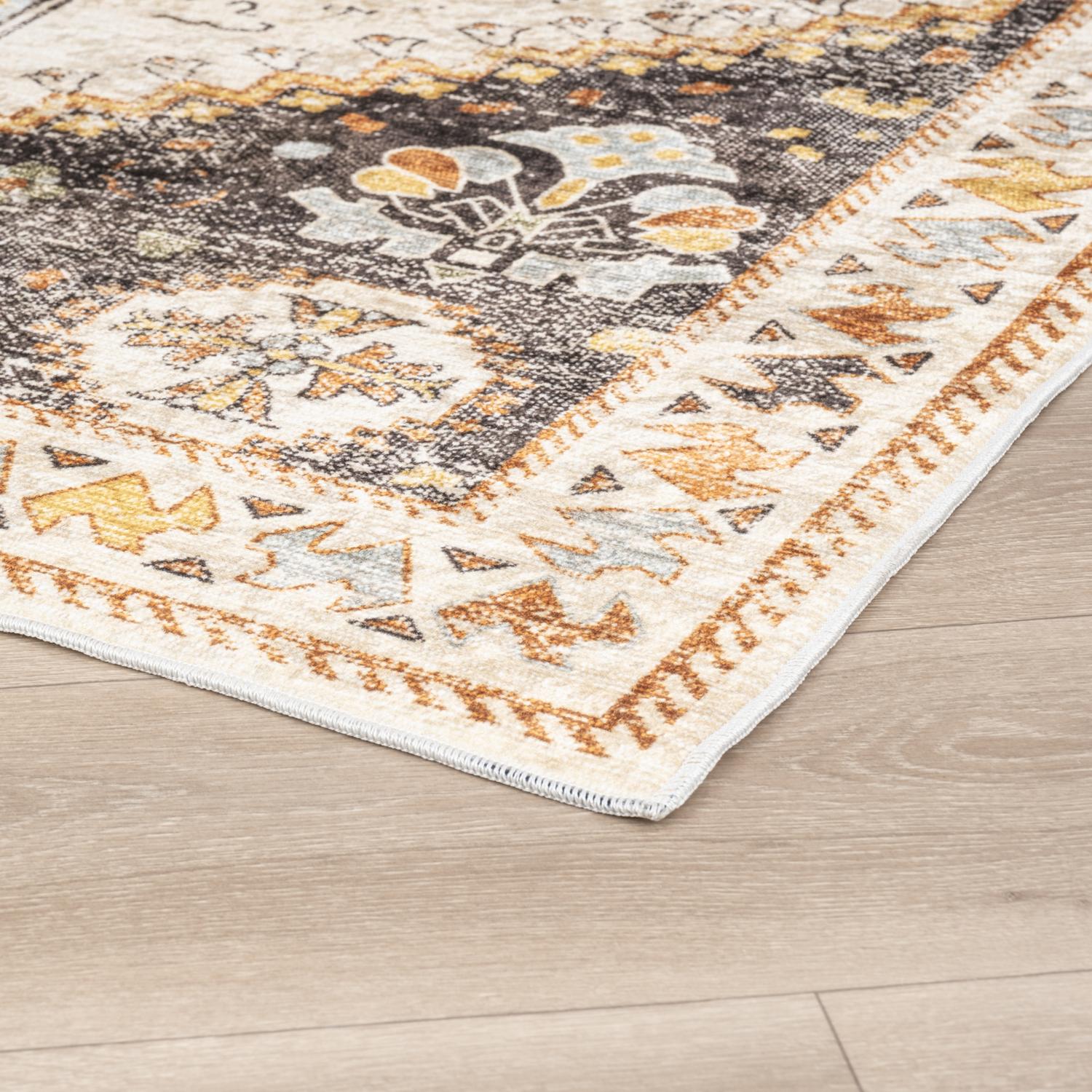Olive Bursa machine washable area rug 3' x 5' - corner detail on hardwood floor