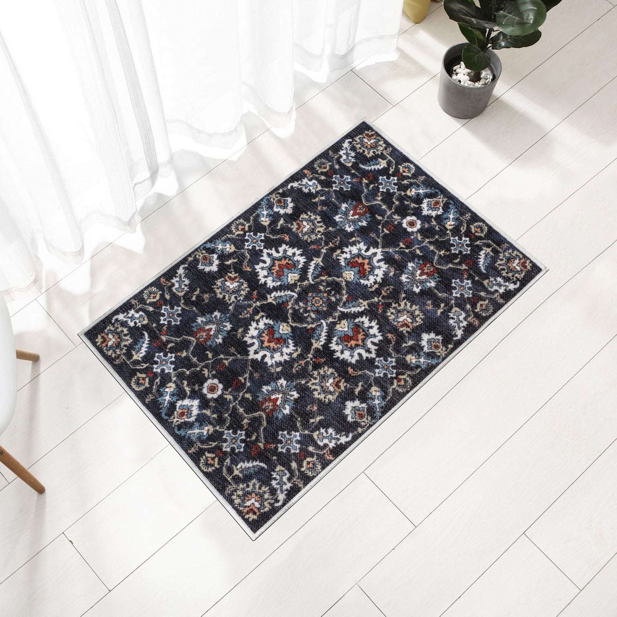 Navy Konya machine washable area rug 2' x 3' - styled in a room