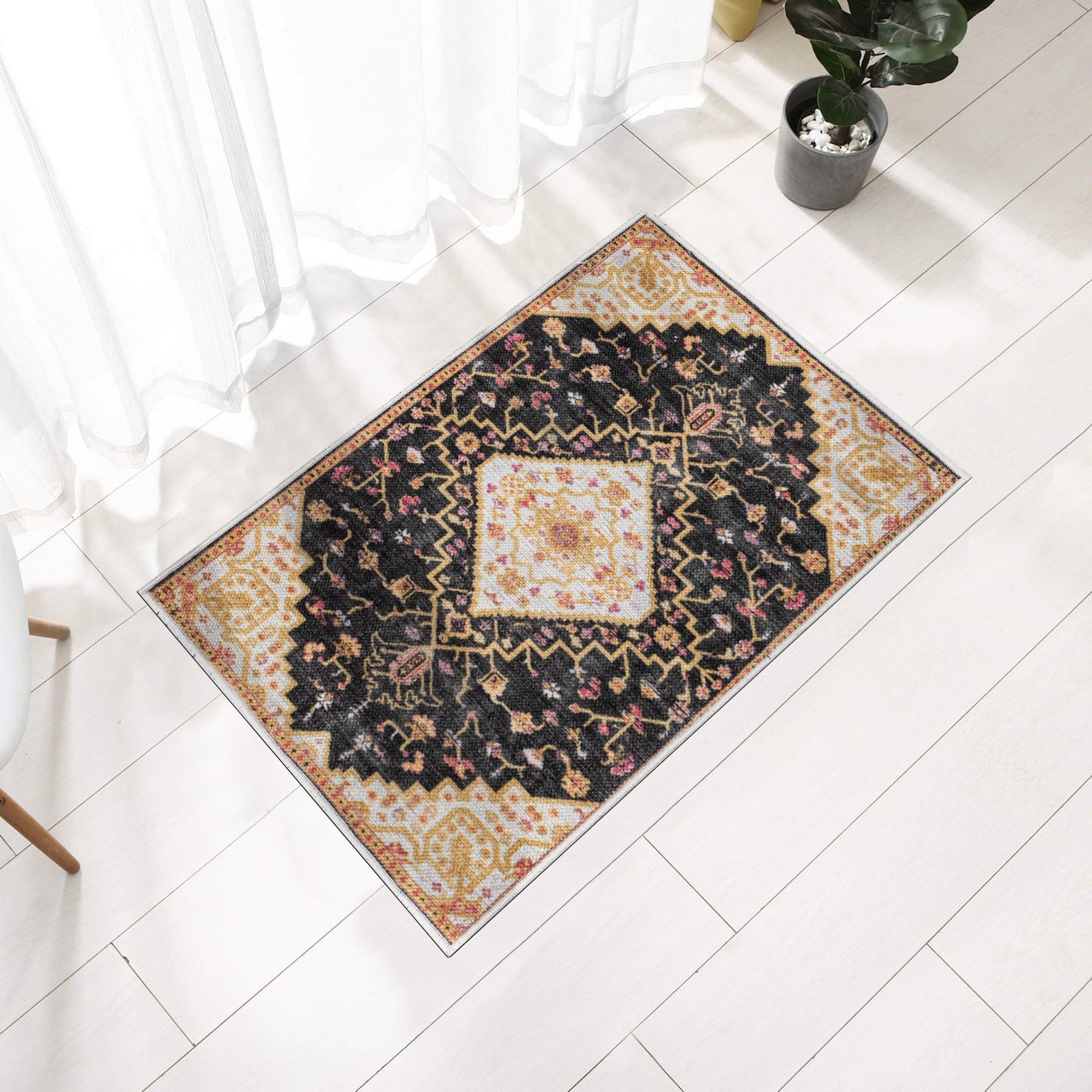 Charcoal Konya machine washable area rug 2' x 3' - styled in a room
